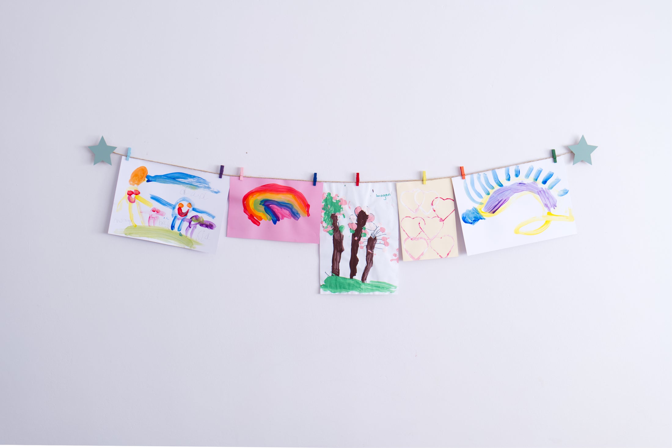 Kids art display with sage green stars