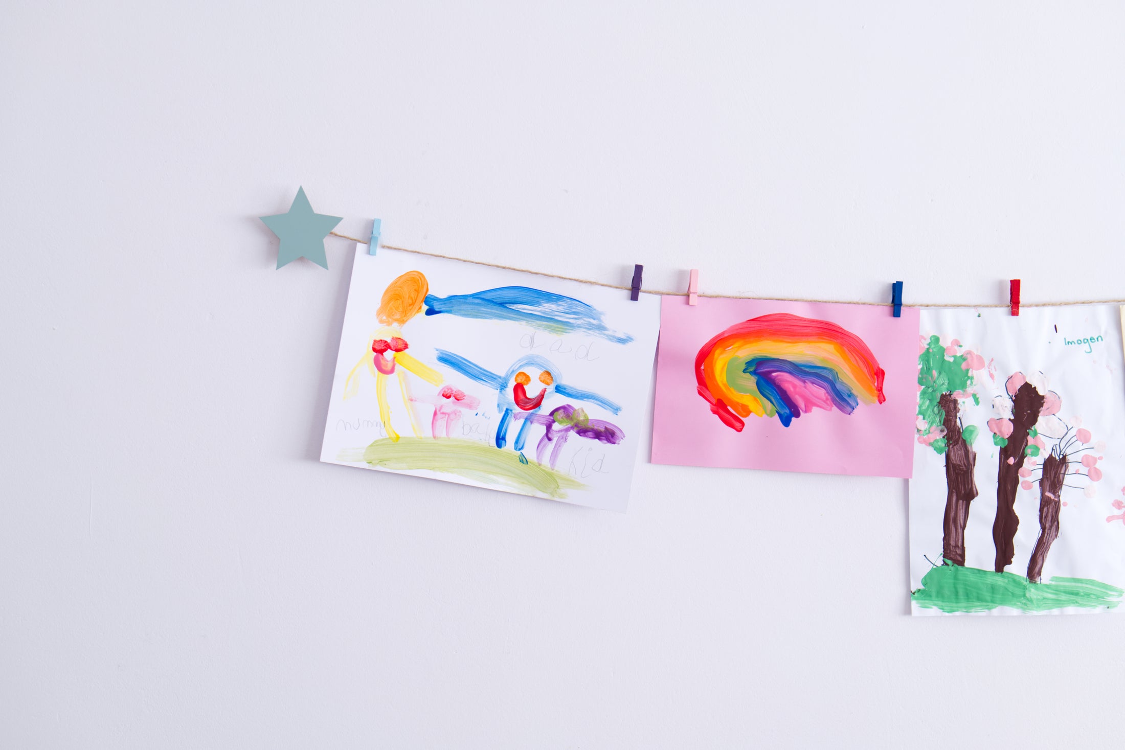 Kids art display with sage green stars