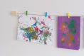 Load image into Gallery viewer, Kids art display with colourful mini clothespins hanging up two pieces of artwork
