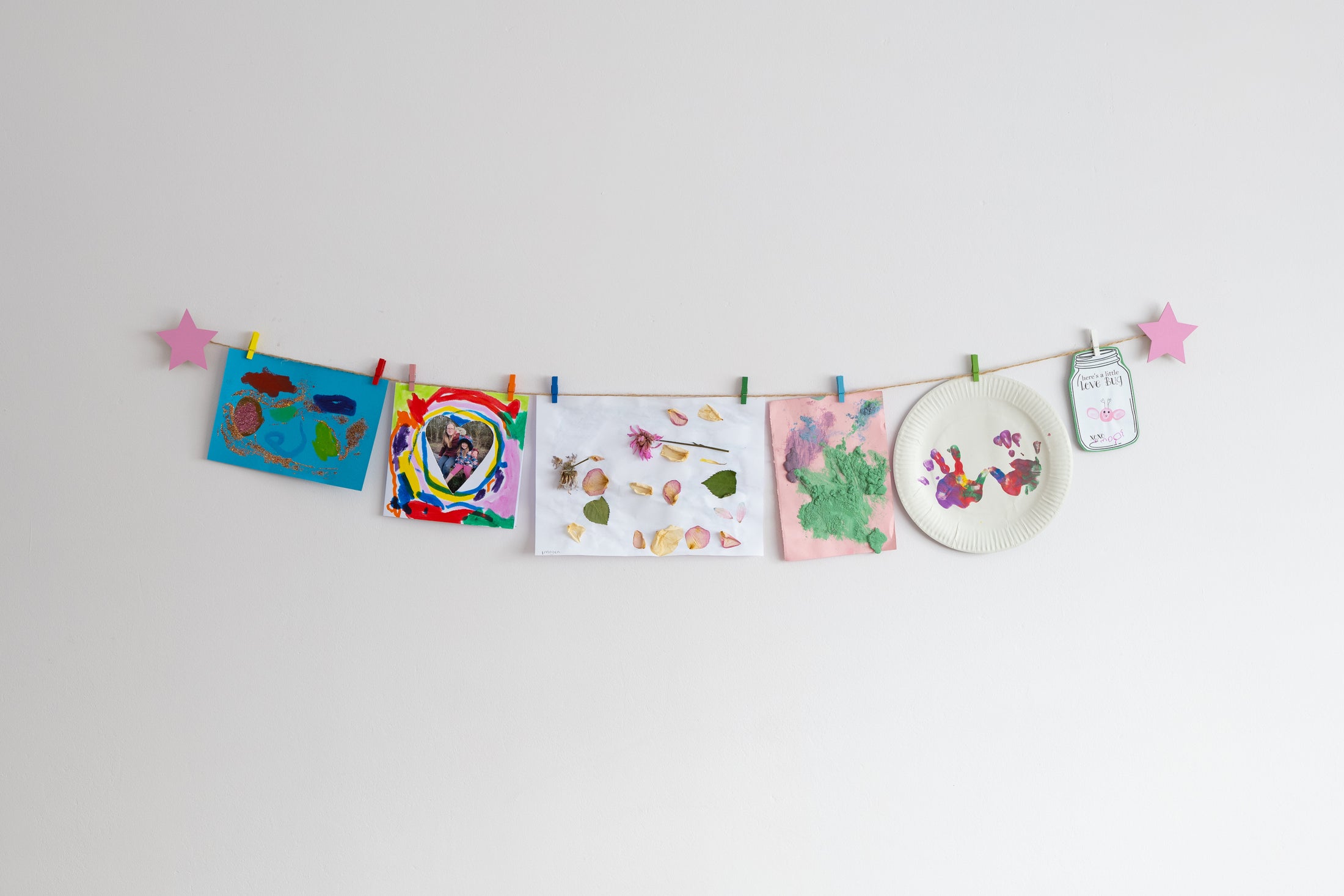 Kids art display with pink stars