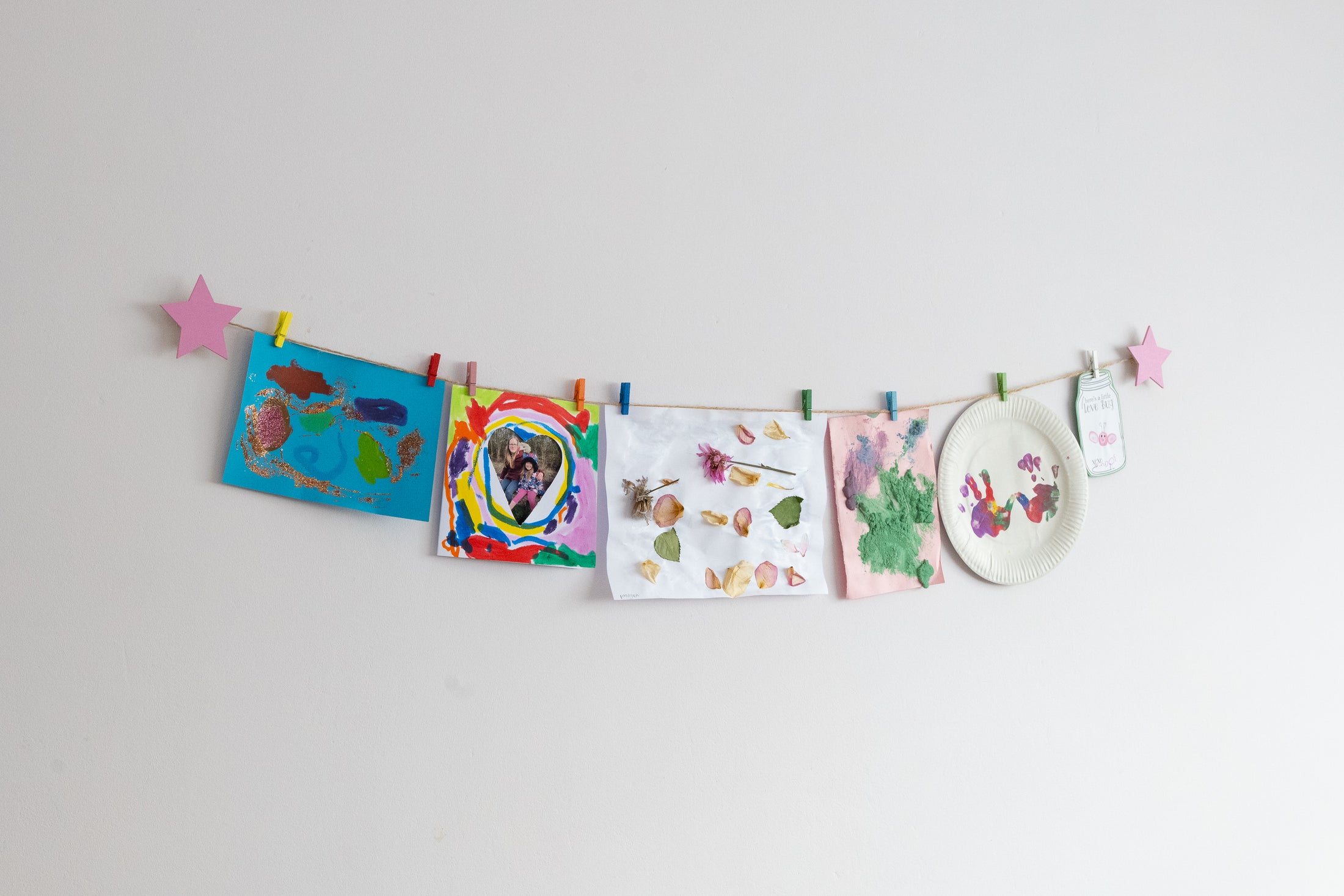 Kids art display with pink stars