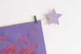Load image into Gallery viewer, Kids art display with lavender stars
