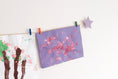 Load image into Gallery viewer, Kids art display with lavender stars
