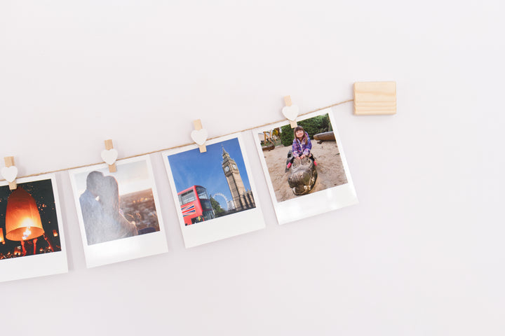 White hearts clothes peg photo display
