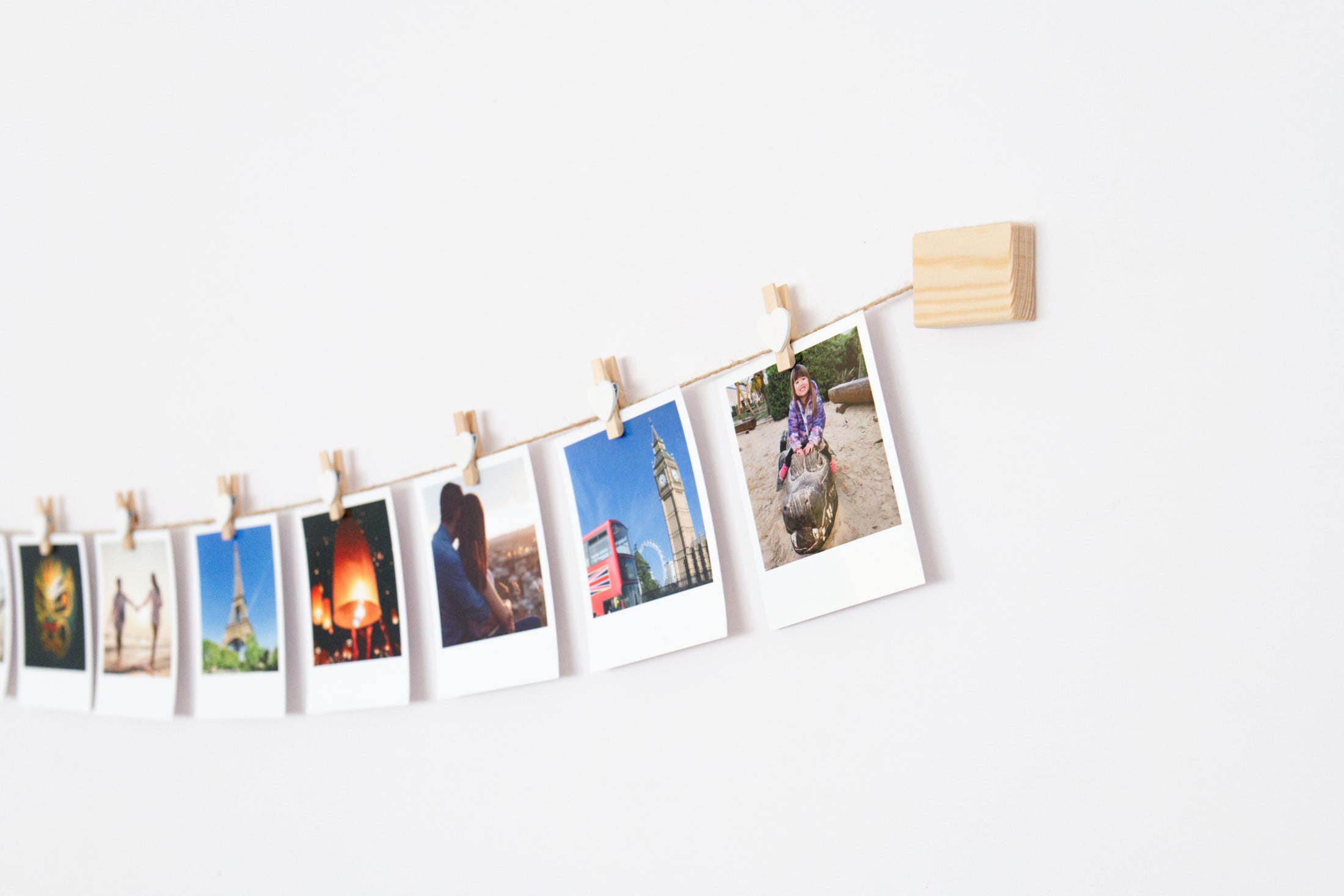 White hearts clothes peg photo display