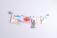 Load image into Gallery viewer, Kids art display with sage green stars
