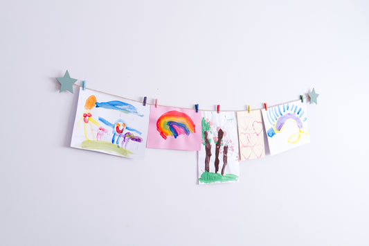 Kids art display with sage green stars
