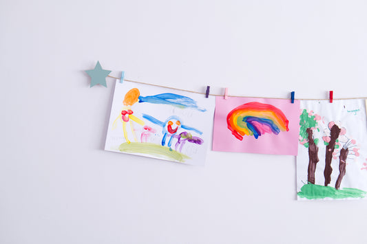 Kids art display with sage green stars