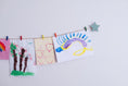 Load image into Gallery viewer, Kids art display with sage green stars
