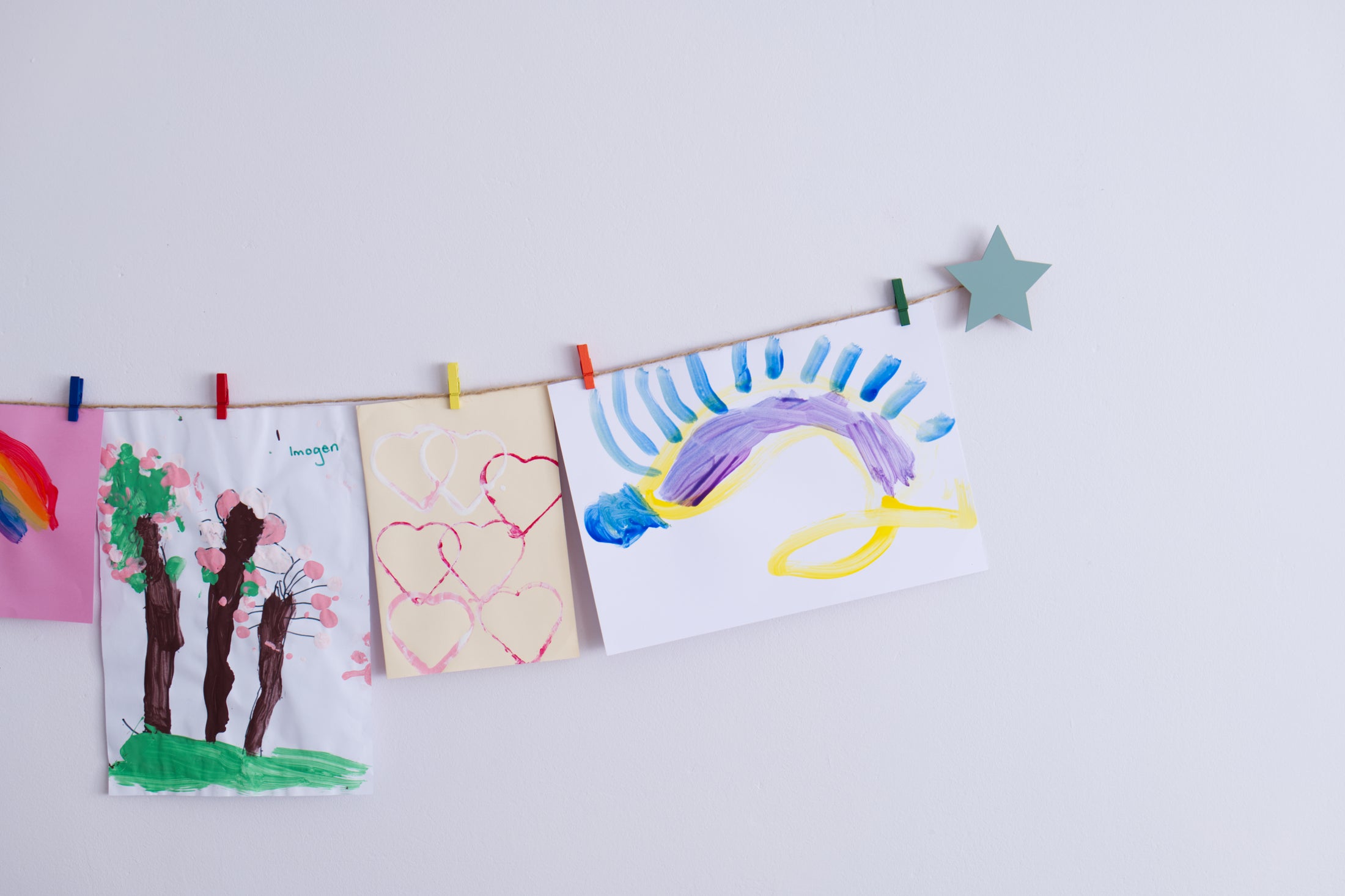 Kids art display with sage green stars