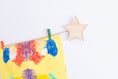 Load image into Gallery viewer, Kids art display with wooden stars
