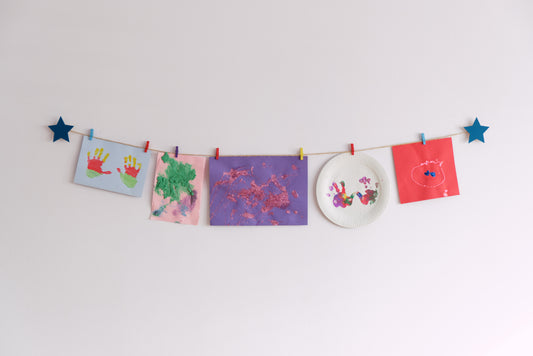 Kids art display with teal stars