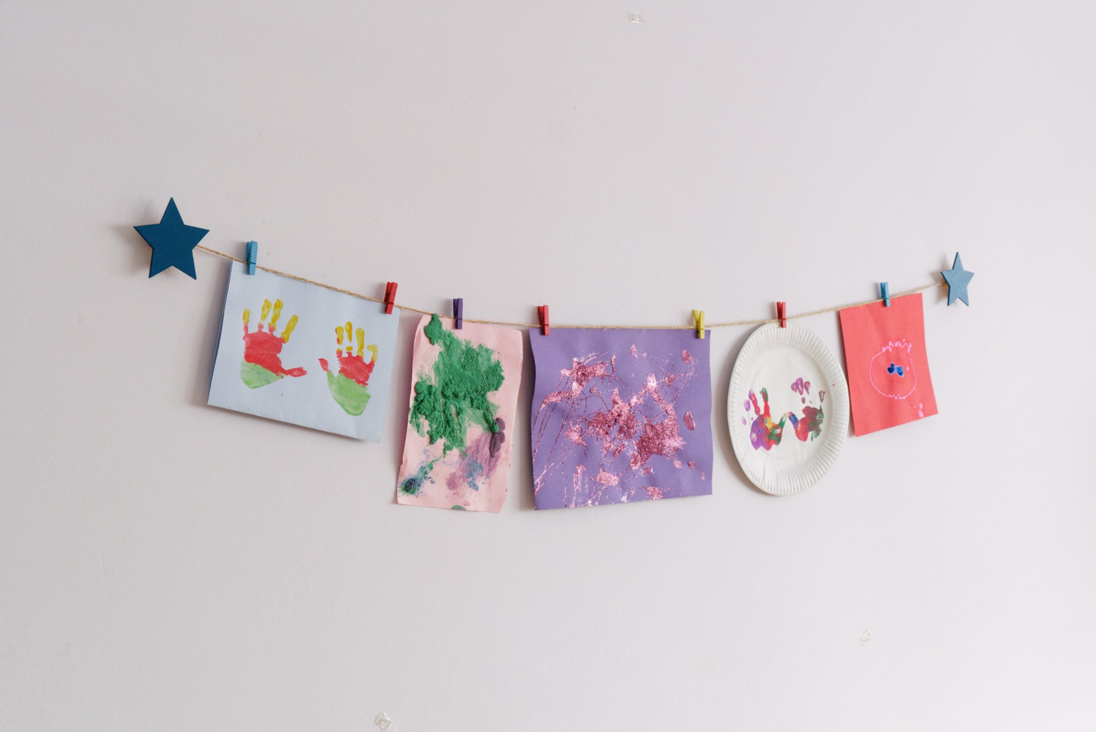 Kids art display with teal stars