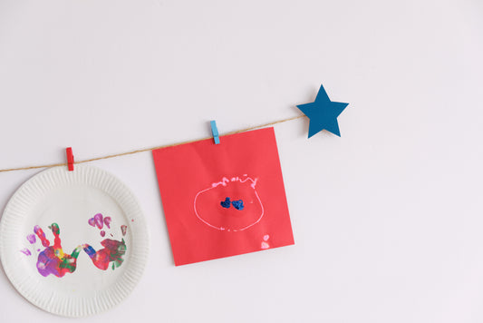 Kids art display with teal stars