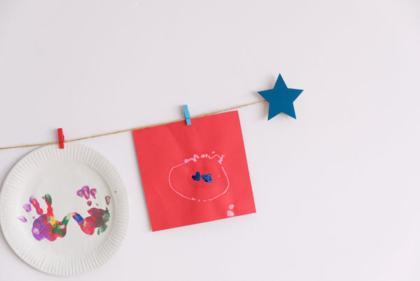 Kids art display with teal stars