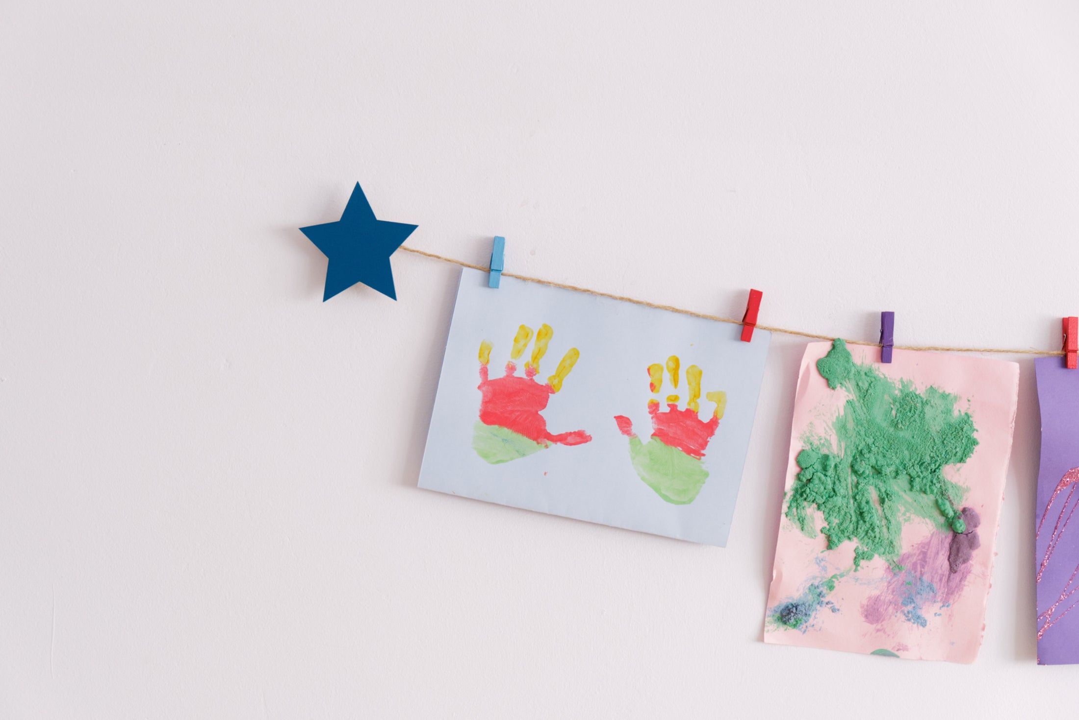 Kids art display with teal stars