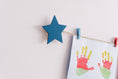 Load image into Gallery viewer, Kids art display with teal stars
