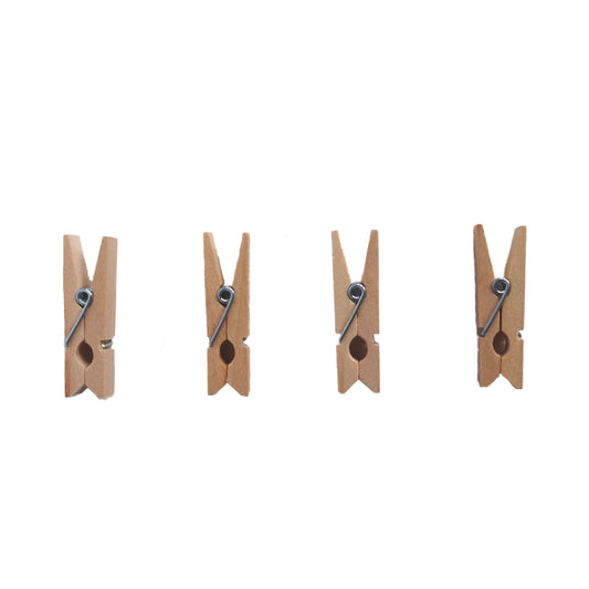 A set of four wooden mini clothes pegs, lying flat, typically used for hanging art, crafts or photos on a string hanging line
