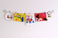 Load image into Gallery viewer, Kids art display with silver stars

