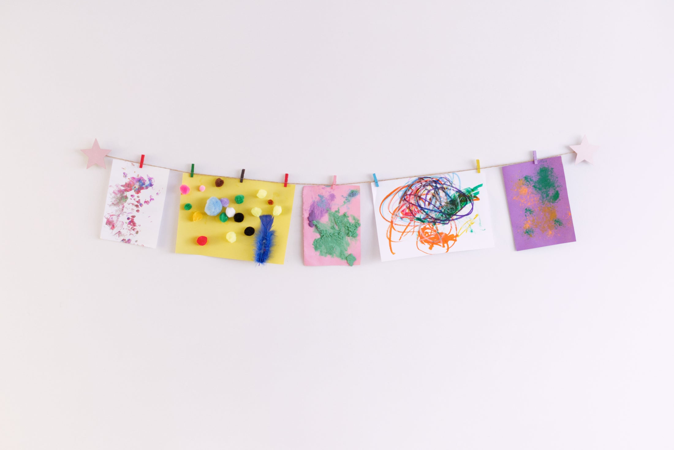 Kids art display with metallic pink stars