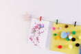 Load image into Gallery viewer, Kids art display with metallic pink stars
