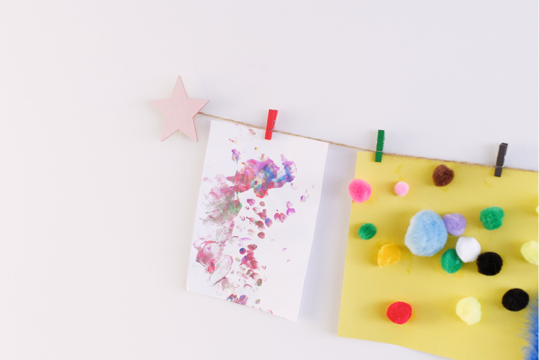 Kids art display with metallic pink stars