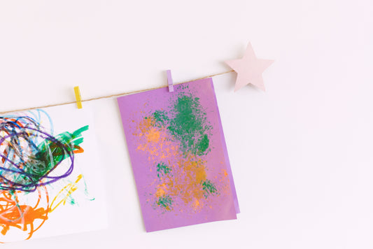 Kids art display with metallic pink stars