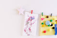 Load image into Gallery viewer, Kids art display with metallic pink stars
