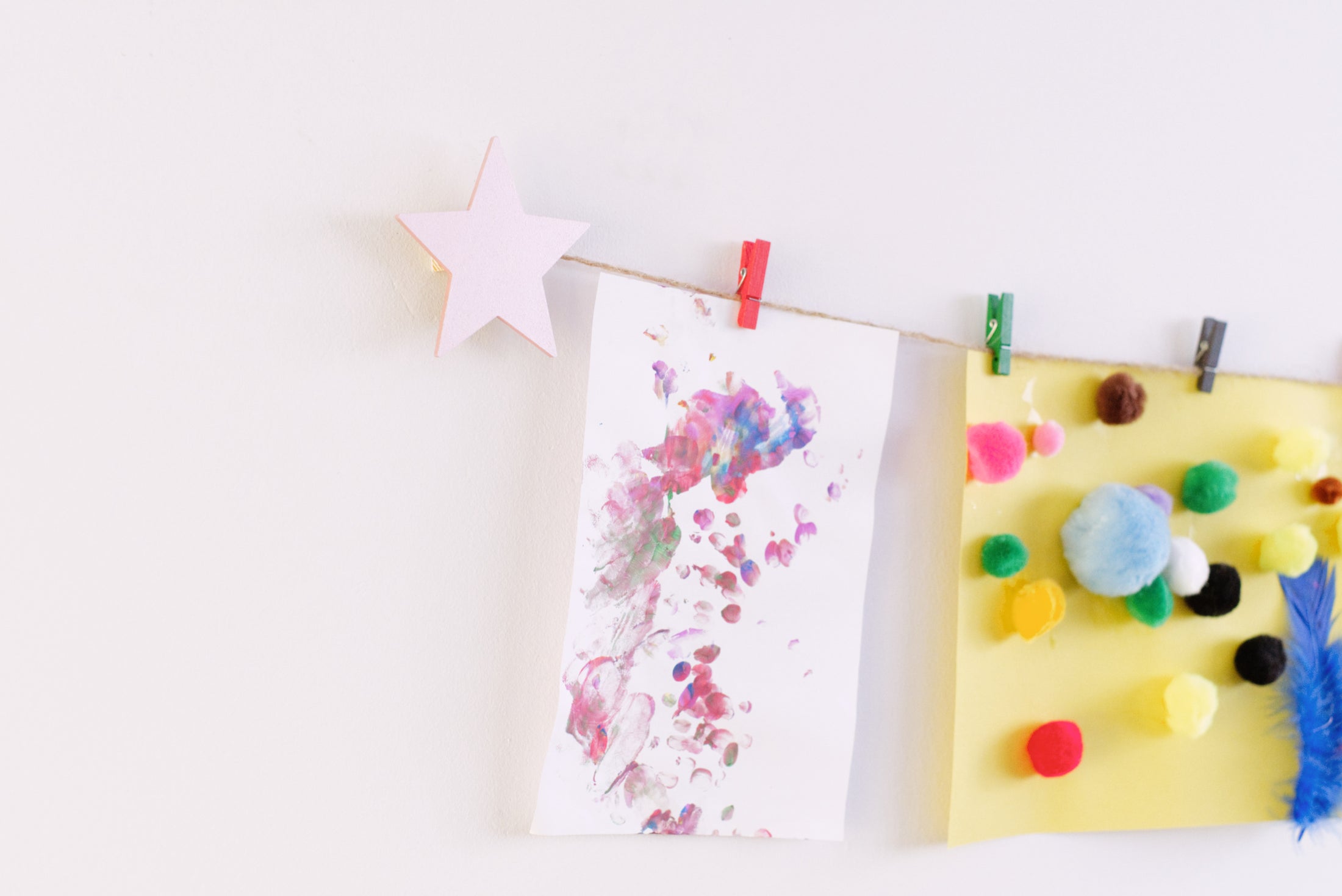Kids art display with metallic pink stars