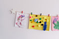Load image into Gallery viewer, Kids art display with white stars

