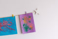 Load image into Gallery viewer, Kids art display with white stars
