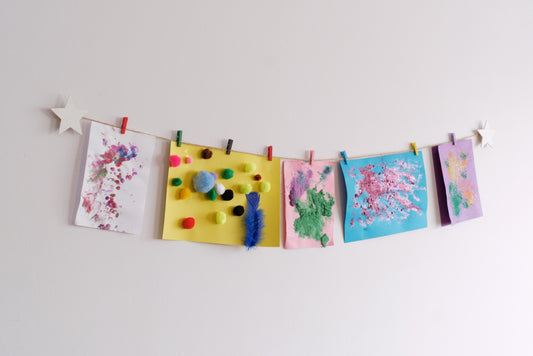 Kids art display with white stars