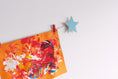Load image into Gallery viewer, Kids art display with blue stars
