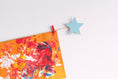 Load image into Gallery viewer, Kids art display with blue stars
